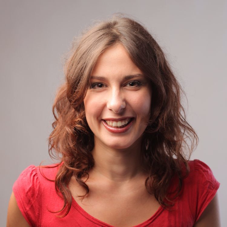 A woman with long hair wearing a red shirt.